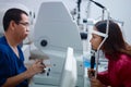 Eyesight exam with Asian doctor and patient Royalty Free Stock Photo