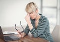 Lady At Laptop Massaging Nosebridge Holding Eyeglasses Sitting At Workplace Royalty Free Stock Photo