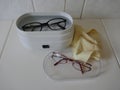 Eyewear cleaning in an electric ultrasonic cleaning device