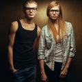 Eyewear concept. Portrait of gorgeous red-haired ginger fashion twins in casual shirts wearing trendy glasses and posing over Royalty Free Stock Photo