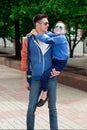 Eyewear concept. Young stylish father with the young cheerful s