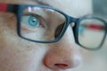 Eyewear glasses woman closeup portrait looking at the camera thoughtfully, selective focus Royalty Free Stock Photo