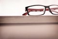 Eyewear on wood table and white background front low angle