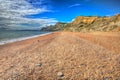 Eype pebble and shingle Dorset Jurassic coast in bright colourful HDR Royalty Free Stock Photo