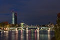 The EZB building in Frankfurt during blue hour with a lit bridge