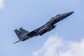 F-15E Strike Eagle taking off under a blue sky