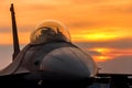 F 16 falcon fighter jet on sunset Royalty Free Stock Photo