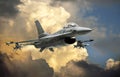 F-16 Fighting Falcon fighter jet model against dramatic clouds Royalty Free Stock Photo
