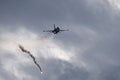 F16 Hellenic Air Force dropping flares during maneuvers over Kalamata during Air Force Celebration Royalty Free Stock Photo