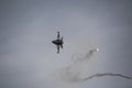 F16 Hellenic Air Force dropping flares during maneuvers over Kalamata during Air Force Celebration Royalty Free Stock Photo