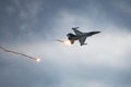 F16 Hellenic Air Force dropping flares during maneuvers over Kalamata during Air Force Celebration Royalty Free Stock Photo