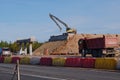 F the international highway Scandinavia. Road, construction machinery, workers, cars, excavator, tractor, bridge