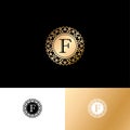 F letter or monogram. The original gold F letter symbol in a circle with lace ornament.