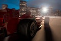 F1 race car speeding in a track with a city background Royalty Free Stock Photo