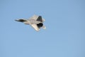 F22 Raptor fighter jet against a blue sky Royalty Free Stock Photo