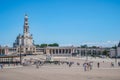 FÃ¡tima, PORTUGAL - 2 July 2023 - Sanctuary with people, Our Lady of FÃ¡tima basilica and arcades in the background