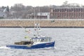 F/V Intimidator with hurricane barrier in background Royalty Free Stock Photo