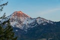 Faakersee - Panoramic view on snow capped mountain peak Mittagskogel Kepa seen from lake Faak in Carinthia