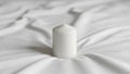 The fabric and candle create a minimalist and serene composition Royalty Free Stock Photo