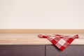 Fabric checkered towel on wooden table