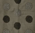 Fabric decorated with circles of glass beads