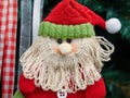 Fabric decorative santa claus hung up on Christmas tree