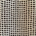 Fabric embossed network in white. Abstract macro shot. Royalty Free Stock Photo