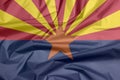 Fabric flag of Arizona. Crease of Arizona flag background, The states of America. Royalty Free Stock Photo