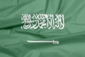 Fabric flag of Saudi Arabia. Crease of Saudi Arabian flag background. Royalty Free Stock Photo