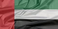 Fabric flag of United Arab Emirates. Crease of UAE flag background. Royalty Free Stock Photo