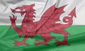 Fabric flag of Wales. Crease of Wales flag background.