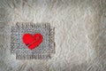 Fabric heart attached on canvas with safety pin Royalty Free Stock Photo
