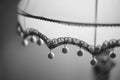 Fabric lampshade with golden balls. Close-up, selective focus. BW photo
