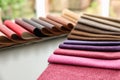 Fabric and leather samples of different colors design on table Royalty Free Stock Photo