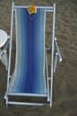 Fabric medical mask on beach chair