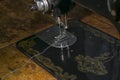 Fabric movement mechanism and needle with a foot of a vintage sewing machine