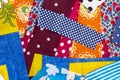 Fabric pattern, patches of colored fabrics as a background, patchwork blanks for home crafts