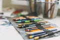 Fabric pencil case with the colored pencils close up artist tools selective focus background Royalty Free Stock Photo