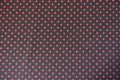 Fabric with polka dot pattern in black and red