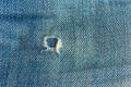 fabric ripped hole classic denim jeans close up texture Royalty Free Stock Photo