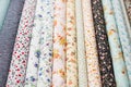 Fabric rolls with floral pattern on textile market