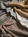 Fabric samples in various colors spread across a design table surface Royalty Free Stock Photo