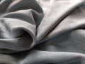 Fabric sheer curtain fabric. Beautiful gray-blue color. Soft velvet with a pile. The curtain material is carelessly folded and