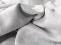 Fabric sheer curtain fabric. Beautiful gray-blue color. Soft velvet with a pile. The curtain material is carelessly folded and