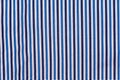 Fabric shirt with vertical stripes blue, light blue and white texture background. Royalty Free Stock Photo