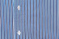 Fabric shirt with vertical stripes blue, light blue and white texture background. Royalty Free Stock Photo