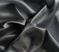 Fabric silk satin texture background black silber color. Royalty Free Stock Photo