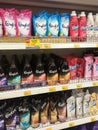 Fabric softeners packed in the plastic bottle and soft pack displayed for sale on the rack. Royalty Free Stock Photo