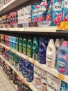 Fabric softeners packed in the plastic bottle and soft pack displayed for sale on the rack. Royalty Free Stock Photo