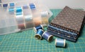 A variety of colorful fabrics and thread spools for color matching. Royalty Free Stock Photo